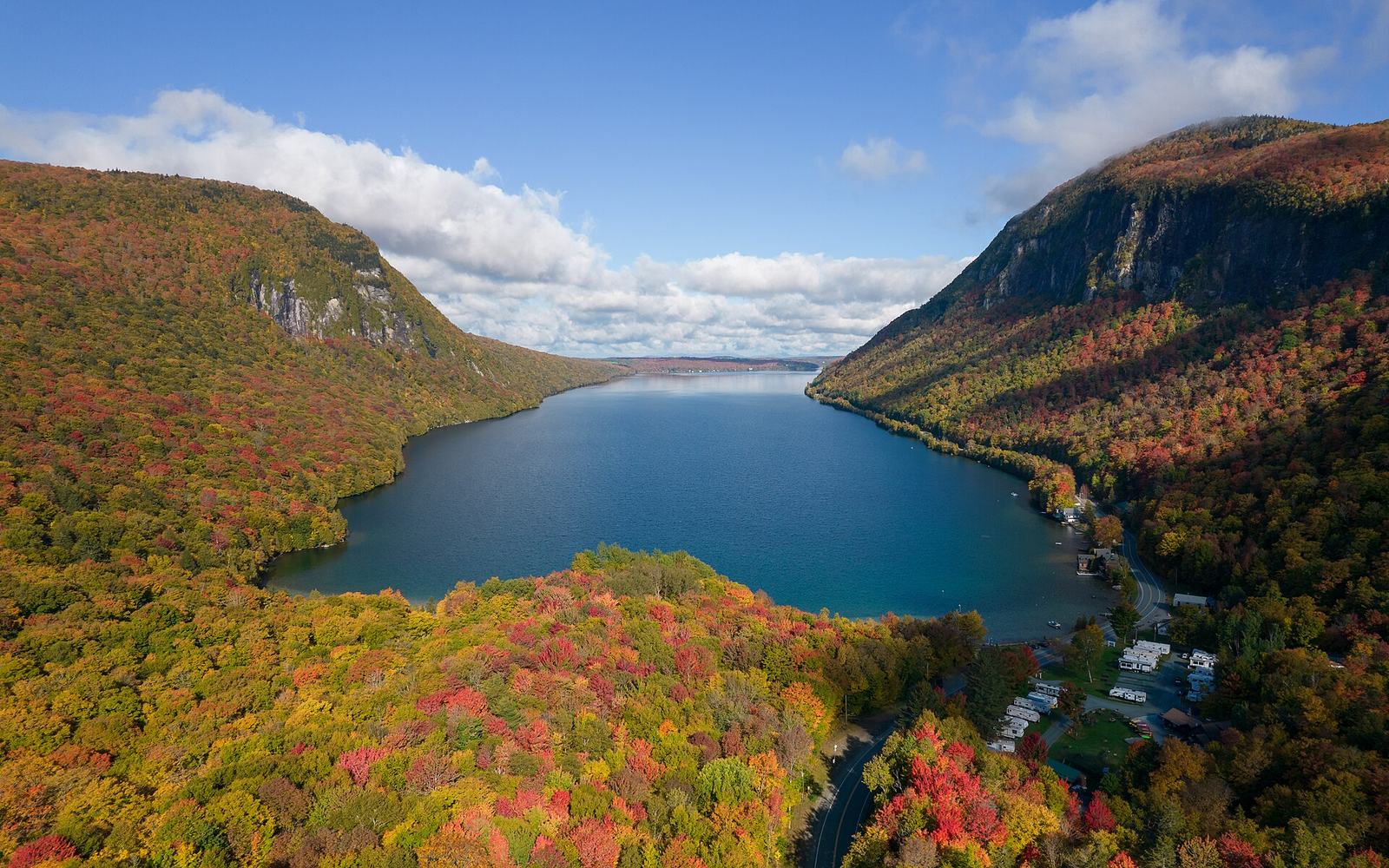 Lake Willoughby between Mount Hor and Mount Pisgah, hillsides in red, orange and gold.